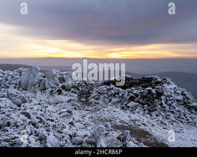 The summit of Red Screes covered by hoar frost at dawn Lake District UK. Stock Photo