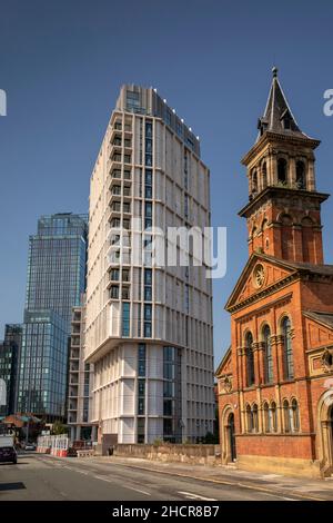 UK, England, Manchester, Castlefield, A56 Chester Road, Former Congregational Church at Castle Wharf development and Deansgate south towers Stock Photo