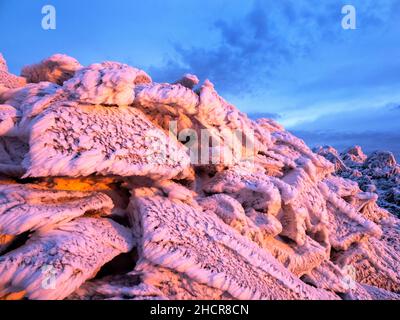 The summit of Red Screes covered by hoar frost at sunrise, Lake District UK. Stock Photo