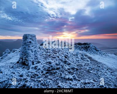 The summit of Red Screes covered by hoar frost at sunrise,  Lake District UK. Stock Photo