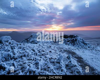 The summit of Red Screes covered by hoar frost at sunrise,  Lake District UK. Stock Photo