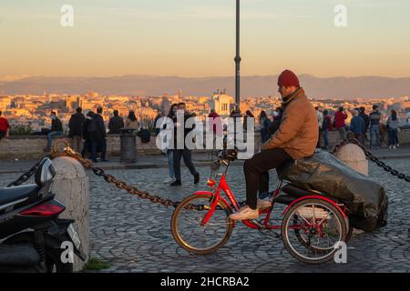 Rome, Italy. 31st Dec, 2021. Tourists observe city of Rome at sunset from Piazzale Garibaldi on Janiculum Hill, on December 31, 2021 (Credit Image: © Matteo Nardone/Pacific Press via ZUMA Press Wire) Credit: ZUMA Press, Inc./Alamy Live News Stock Photo