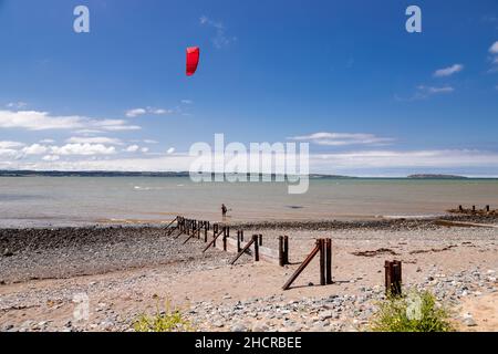 Kite surfer on the beach at Llanfairfechan, North Wales Stock Photo