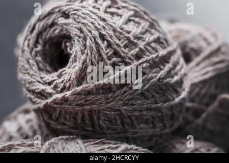 Light brown wool yarn made of threads in tangles. Needlework Stock Photo