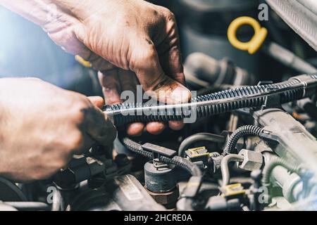 Auto mechanic working in garage Stock Photo