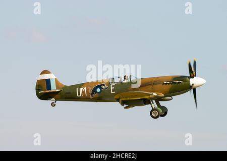 Second World War Vickers Supermarine Spitfire Mk.XIX fighter plane PS890 landing. Griffon powered Mk19 Spitfire in South East Asia colour scheme Stock Photo