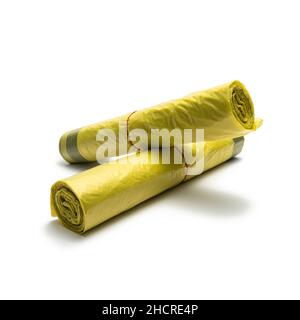 rolls of yellow garbage bags isolated on white background Stock Photo