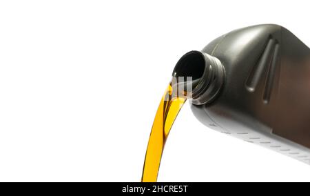 Pouring oil lubricant motor car from silver bottle on isolated white background Stock Photo
