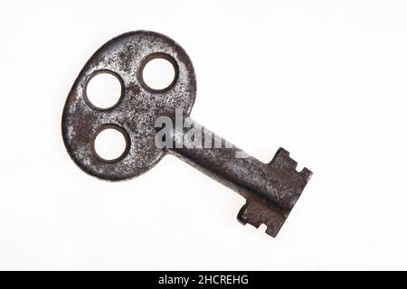 Old rusty key isolated on a white background Stock Photo
