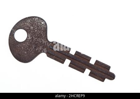 Old rusty key isolated on a white background Stock Photo