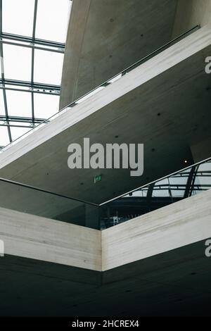 A vertical shot of a modern glass architectural building with ...