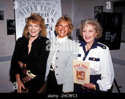 Angie Dickinson, Dinah Shore and Betty White during The Dinah Shore American Kitchen Book Party on October 29, 1990 at Orso Restaurant in Beverly Hills, California Credit: Ralph Dominguez/MediaPunch Stock Photo