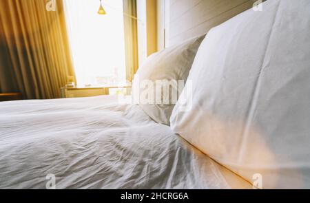 Interior of a modern new double bed hotel bedroom Stock Photo