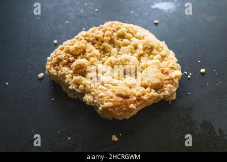 streusel bun or roll on old table Stock Photo