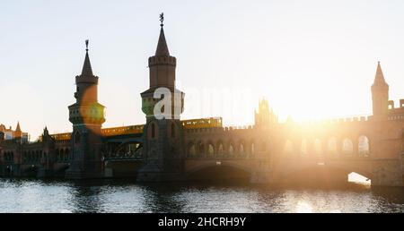 Berlin sunset city skyline at Oberbaum Bridge and Spree River, Berlin, Germany Stock Photo