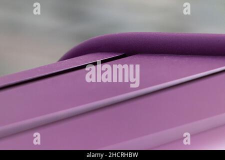 Shallow focus of a purple soft surface with a blurred gray background Stock Photo