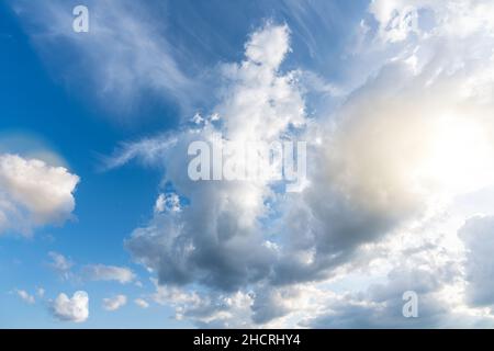 Sun beams or light rays breaking through the clouds Stock Photo