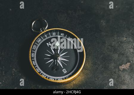 compass on a table concept for direction, travel, guidance or assistance Stock Photo
