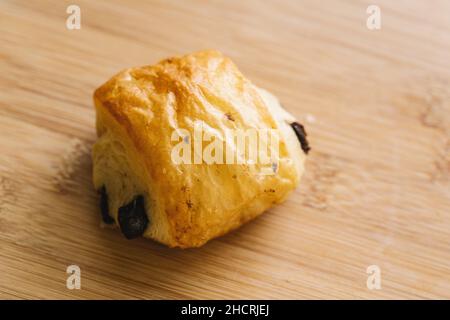 Croissants with chocolate on a wooden table Stock Photo