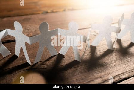 Paper People Teamwork Holding Hands. Business Concept image Stock Photo
