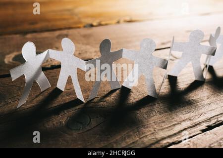 Paper People Holding Hands Teamwork Stock Photo