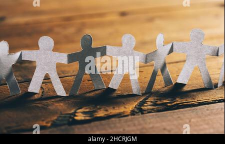 Paper People Holding Hands Stock Photo