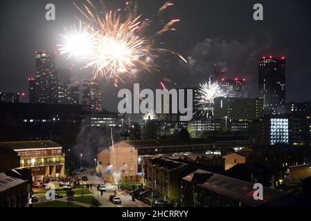 Fireworks in Manchester, England, United Kingdom, British Isles, at midnight to welcome the New Year 2022.