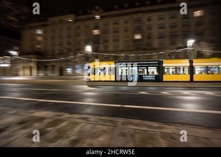 Dresden, Germany. 01st Jan, 2022. An empty tram drives through downtown Dresden shortly before midnight. Credit: Daniel Schäfer/dpa-Zentralbild/dpa/Alamy Live News Stock Photo