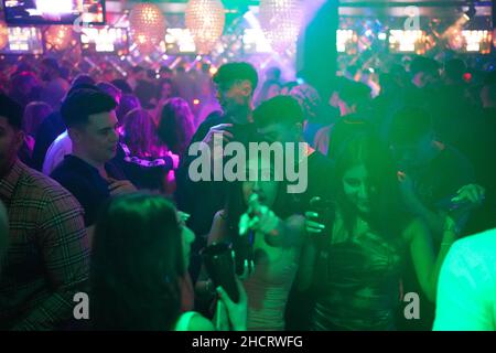 Revellers at Players Bar in Birmingham during New Year's Eve celebrations. Picture date: Friday December 31, 2021. Stock Photo