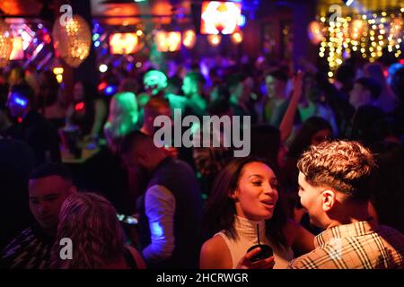 Revellers at Players Bar in Birmingham during New Year's Eve celebrations. Picture date: Friday December 31, 2021. Stock Photo