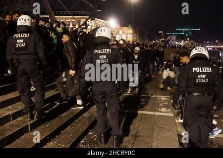 Duesseldorf, Germany. 01st Jan, 2022. Police officers in helmets guard the many revellers on New Year's Eve on the Rhine in Düsseldorf. Credit: David Young/dpa/Alamy Live News Stock Photo