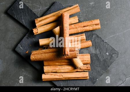 Group of Cinnamon Sticks also known as quills are dried strips of bark from the cinnamon tree. Stock Photo