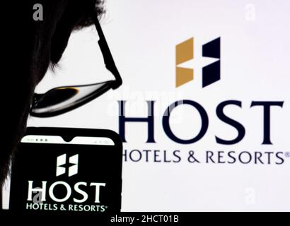 Ukraine. 31st Dec, 2021. In this photo illustration Host Hotels & Resorts, Inc. logo seen displayed on a smartphone and in the background. Credit: SOPA Images Limited/Alamy Live News Stock Photo