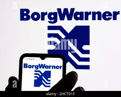 Ukraine. 31st Dec, 2021. In this photo illustration BorgWarner Inc. logo seen displayed on a smartphone and in the background. Credit: SOPA Images Limited/Alamy Live News Stock Photo