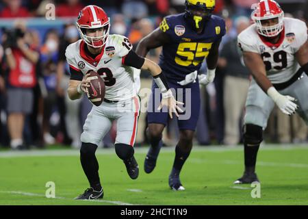 Florida, USA. 31st Dec, 2021. December 31, 2021: Georgia Bulldogs quarterback STETSON BENNETT (13) scrambles with the ball during the 88th Capital One Orange Bowl at Hard Rock Stadium in Miami Gardens, Florida (Credit Image: © Cory Knowlton/ZUMA Press Wire) Credit: ZUMA Press, Inc./Alamy Live News Stock Photo