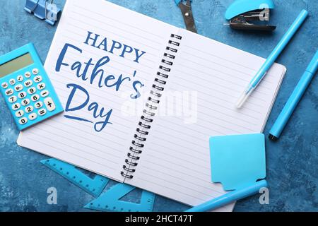 Beautiful greeting card for Father's Day with notebook and stationery Stock Photo