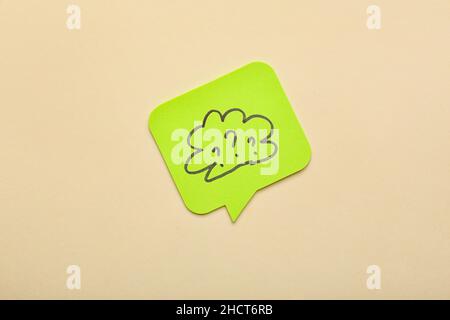Sticky note with drawn cloud and question marks on beige background Stock Photo