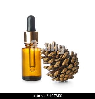 Bottle of essential oil and pine cone isolated on white background Stock Photo