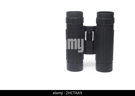 Close up of small rubberized foldable tactical outdoor binoculars with two eyepieces isolated on white background Stock Photo