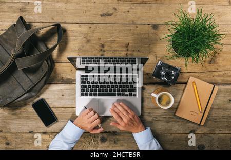 Top view of Businessman using Laptop in Office Stock Photo