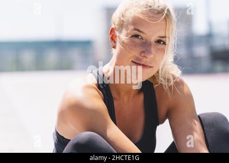 attractive young woman in sportswear enjoying Relaxing after training. Cheerful mood, true emotions, healthy lifestyle Stock Photo