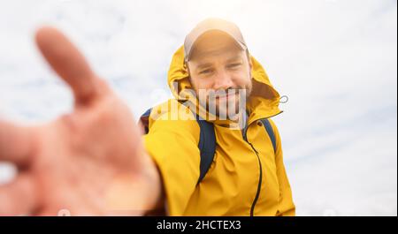 cheerful bearded young man solo traveler taking selfie at the beach - Adventure wanderlust concept on the beach Stock Photo