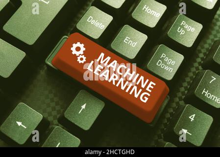 Handwriting text Machine Learning. Business approach the concept that a computer can learn new data itself Typing Image Descriptions And Keywords Stock Photo