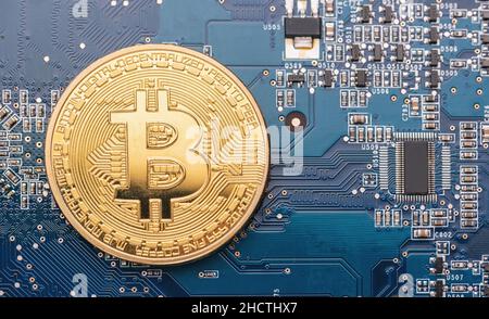 cryptocurrency Bitcoin on a Mother board Stock Photo