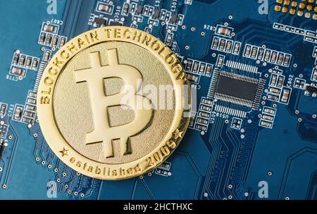 cryptocurrency Bitcoin on a Mother board Stock Photo