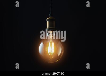 Edison Lightbulb on black background Stock Photo
