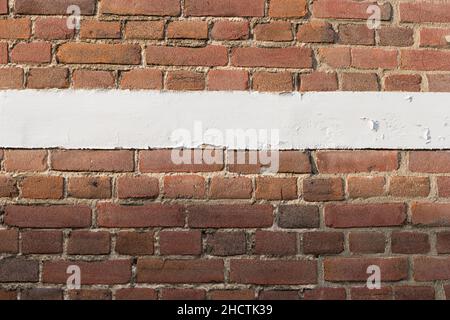 brick wall with white copy space line and red bricks background. vintage brick wall texture Stock Photo
