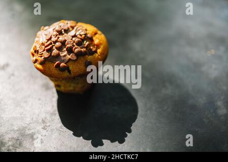 Chocolate cake or muffin, homemade cakes on wooden background Stock Photo