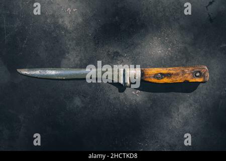 Old Butcher Knife on Rusty Metal Sheet Stock Photo