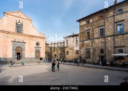 Civita di Bagnoregio,Italy-april 30,2018:strolling in the narrow street of Civita di Bagnoregio during a sunny day.Defined 'the dying city' because it Stock Photo